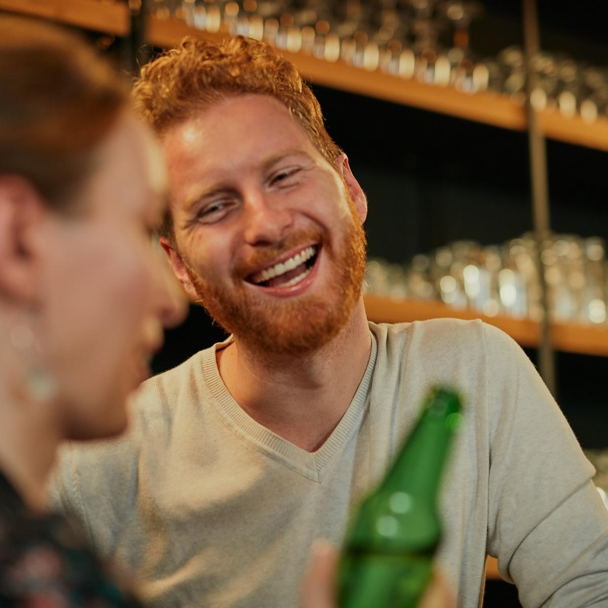 man drinking in a pub
