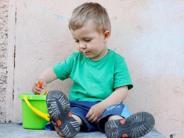toddler boy with a bucket