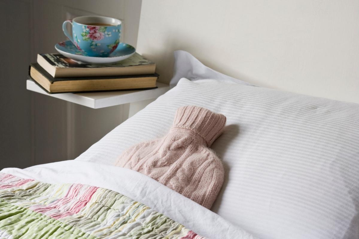 hot water bottle in a bed.